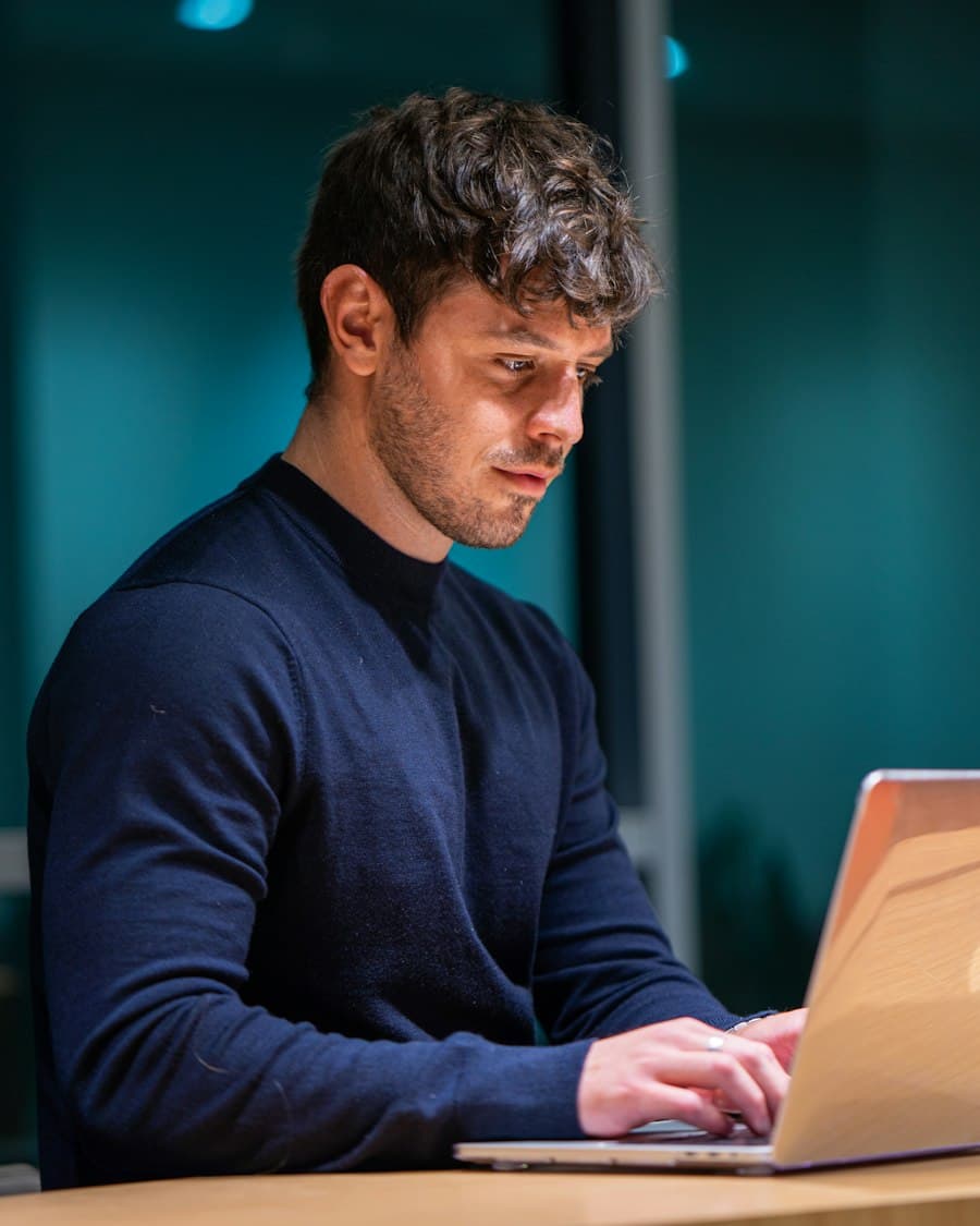 A specialist working alone at a laptop